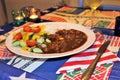 Creole stew with salad and rice